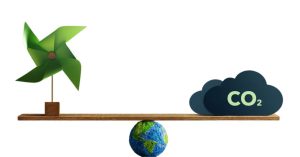 Image of scale, balancing windmill and CO2 on planet Earth.